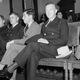 Charles (Lucky) Luciano (center, dark glasses) talks to two members of the Cuban secret police in his cabin on the steamship Bakir, March 19, 1947 in Havana, Cuba, before the start of the voyage to Cenoa, Italy. Luciano, former New York City racketeer, was deported to Italy on a Cuban presidential decree.